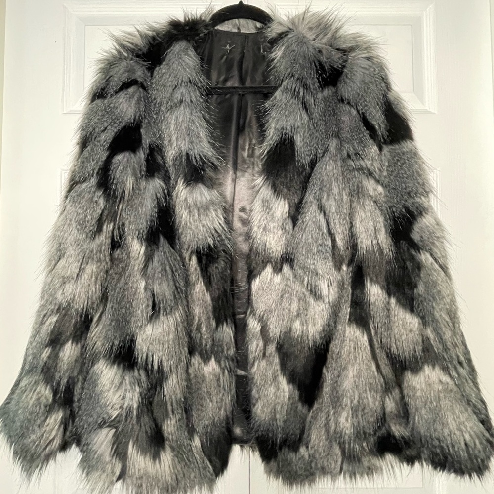 Faux fur coat, waist length.
